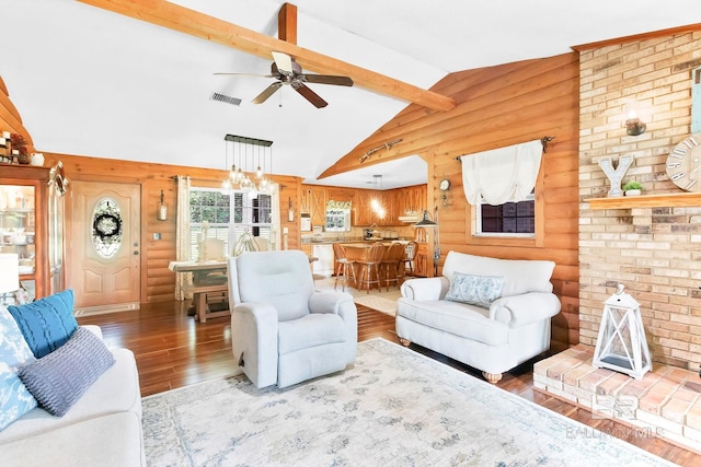 196 Jernigan Rd, Brewton, AL 36426 - living area featuring hardwood / wood-style flooring, ceiling fan, a chandelier, and log walls