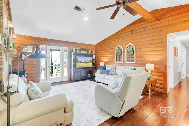 196 Jernigan Rd, Brewton, AL 36426 - living area with rustic walls, hardwood / wood-style floors, a ceiling fan, and vaulted ceiling