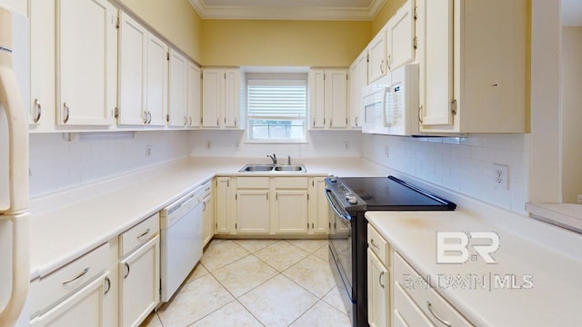 kitchen featuring white appliances, tasteful backsplash, white cabinets, light tile patterned flooring, and sink