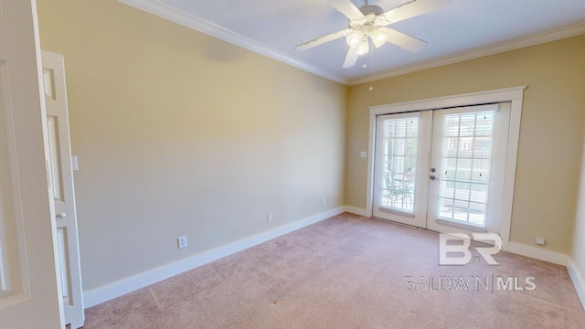 entryway featuring ornamental molding, ceiling fan, french doors, and light colored carpet