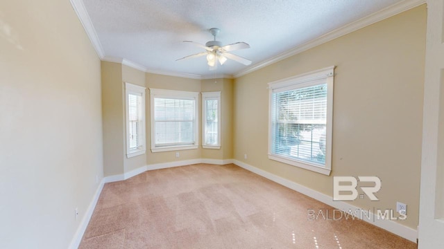 unfurnished room featuring a textured ceiling, light colored carpet, ceiling fan, and crown molding