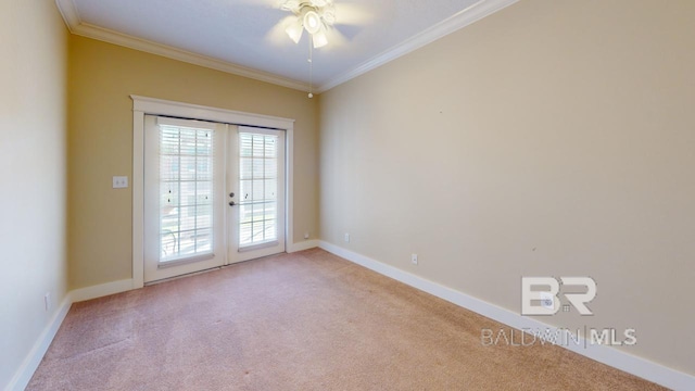 unfurnished room with ceiling fan, french doors, crown molding, and light carpet