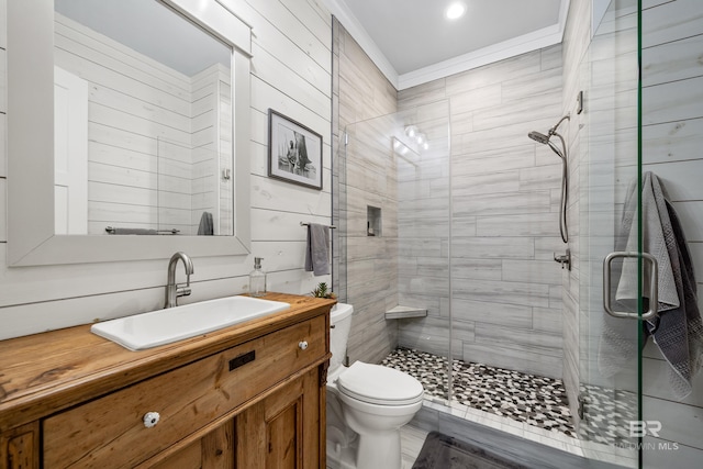 bathroom featuring a stall shower, vanity, and toilet