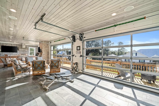 sunroom featuring wood ceiling