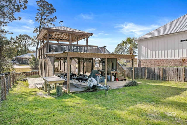 view of yard with a deck, a gazebo, and a fenced backyard