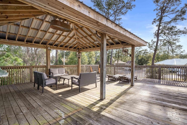 wooden terrace featuring a gazebo and an outdoor hangout area