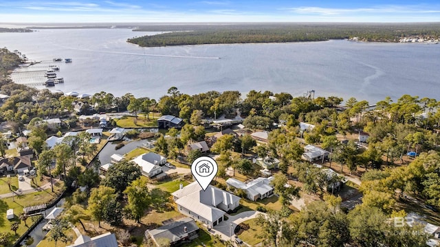 birds eye view of property with a water view and a residential view