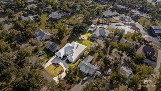 birds eye view of property with a residential view