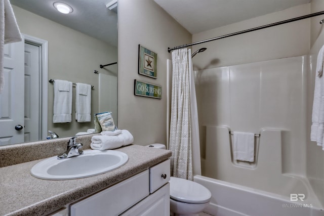 full bathroom featuring toilet, shower / bath combo, and vanity