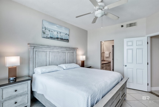 bedroom featuring light tile patterned floors, ensuite bathroom, a ceiling fan, visible vents, and baseboards