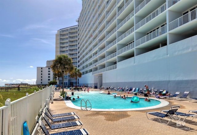 community pool with a patio area