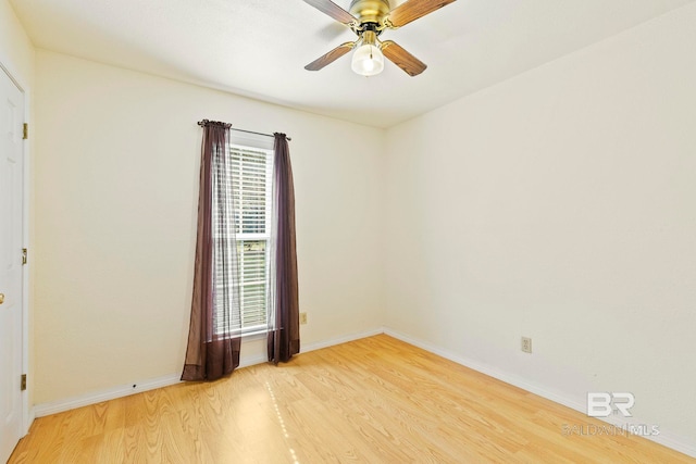 empty room with wood-type flooring and ceiling fan