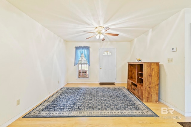 foyer entrance featuring ceiling fan and light hardwood / wood-style floors