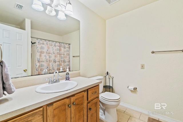 bathroom featuring vanity, a shower with shower curtain, tile patterned floors, and toilet