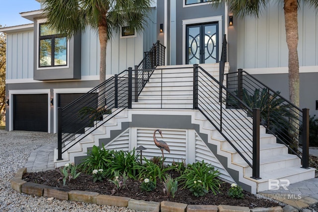 30471 Harbour Dr, Orange Beach, AL 36561 - doorway to property with board and batten siding and an attached garage