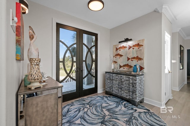 30471 Harbour Dr, Orange Beach, AL 36561 - foyer with french doors, baseboards, wood finished floors, and ornamental molding