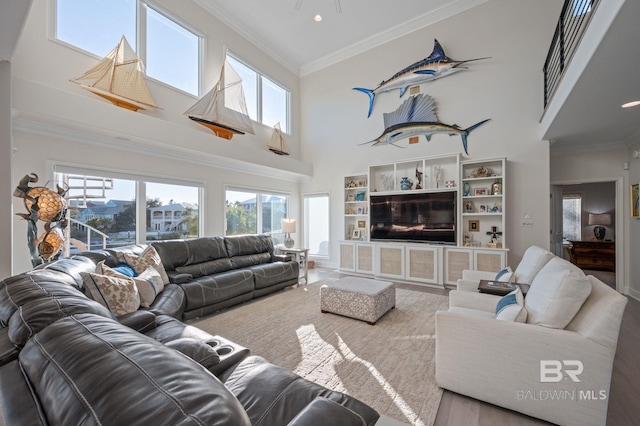30471 Harbour Dr, Orange Beach, AL 36561 - living area featuring crown molding, a high ceiling, and a wealth of natural light