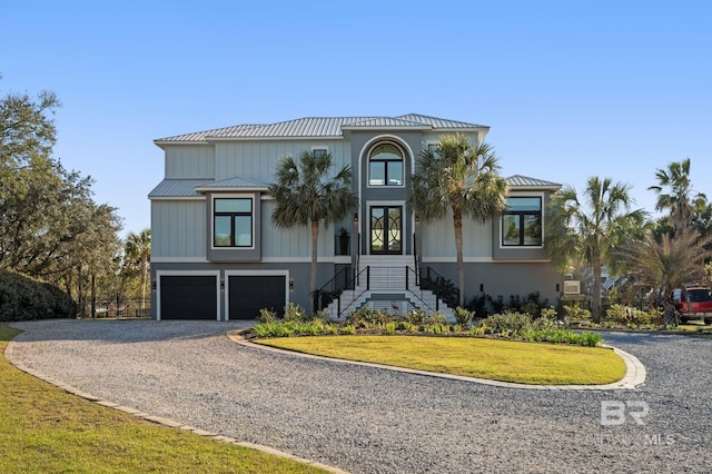 30471 Harbour Dr, Orange Beach, AL 36561 - view of front of house with driveway, a front lawn, and a garage