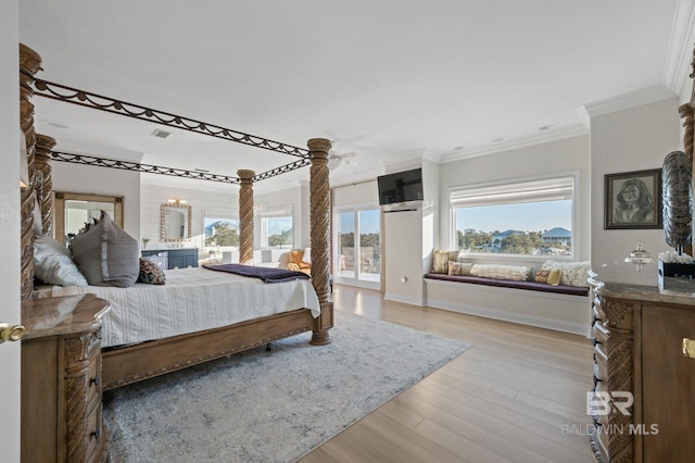 30471 Harbour Dr, Orange Beach, AL 36561 - bedroom featuring an inviting chandelier, crown molding, baseboards, and light wood finished floors