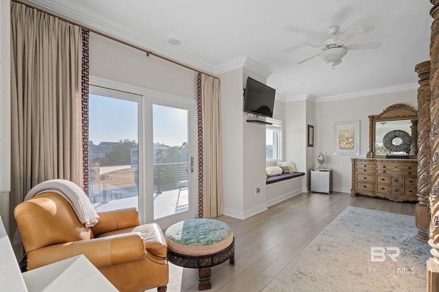 30471 Harbour Dr, Orange Beach, AL 36561 - sitting room featuring light wood-style flooring, baseboards, crown molding, and ceiling fan