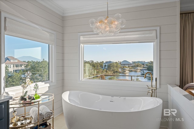 30471 Harbour Dr, Orange Beach, AL 36561 - full bath featuring a wealth of natural light, a freestanding bath, and an inviting chandelier