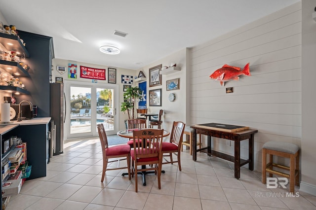 30471 Harbour Dr, Orange Beach, AL 36561 - dining space with visible vents and light tile patterned flooring
