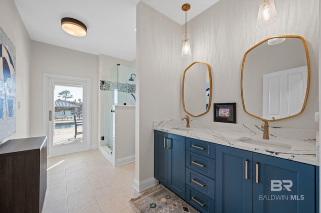 30471 Harbour Dr, Orange Beach, AL 36561 - full bath with a sink, double vanity, and a shower stall