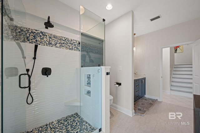 30471 Harbour Dr, Orange Beach, AL 36561 - bathroom with tile patterned floors, visible vents, toilet, a stall shower, and vanity