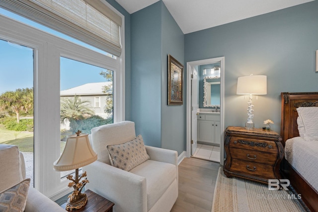30471 Harbour Dr, Orange Beach, AL 36561 - bedroom with baseboards, wood finished floors, and ensuite bathroom