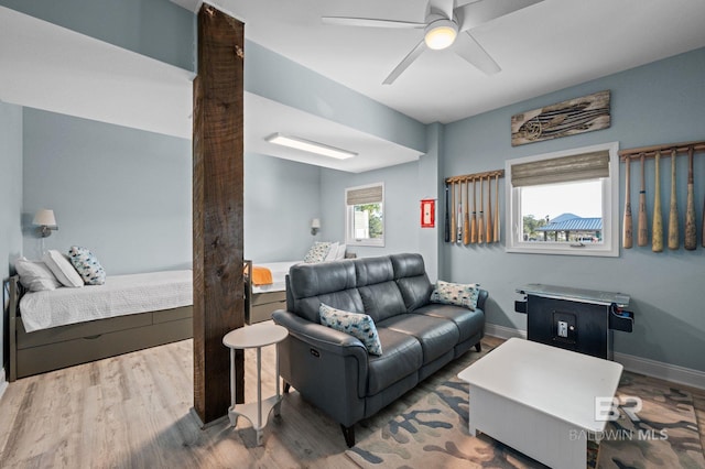 30471 Harbour Dr, Orange Beach, AL 36561 - living room featuring baseboards, wood finished floors, and a ceiling fan