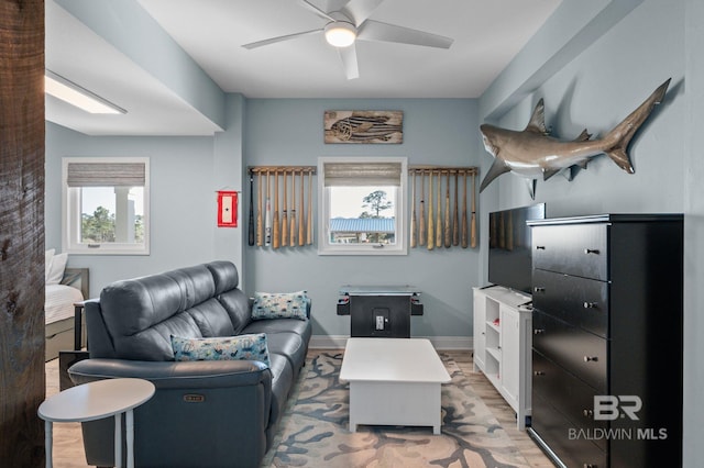 30471 Harbour Dr, Orange Beach, AL 36561 - living room with baseboards, light wood-style floors, and ceiling fan