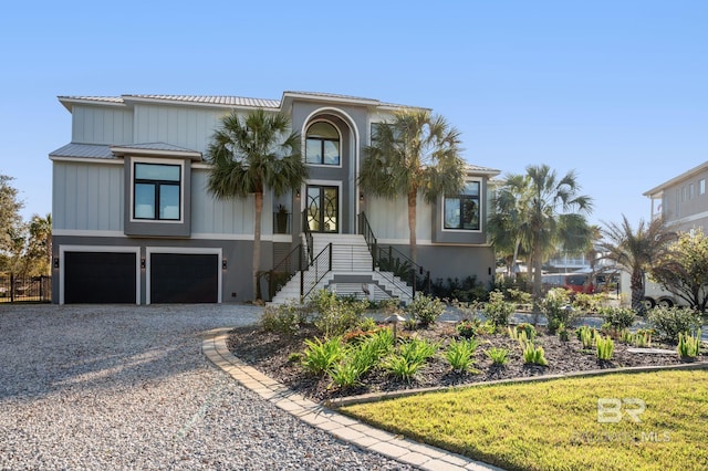 30471 Harbour Dr, Orange Beach, AL 36561 - view of front of property with a garage and gravel driveway