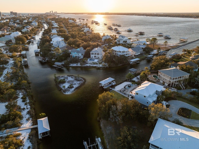 30471 Harbour Dr, Orange Beach, AL 36561 - aerial view at dusk featuring a residential view and a water view