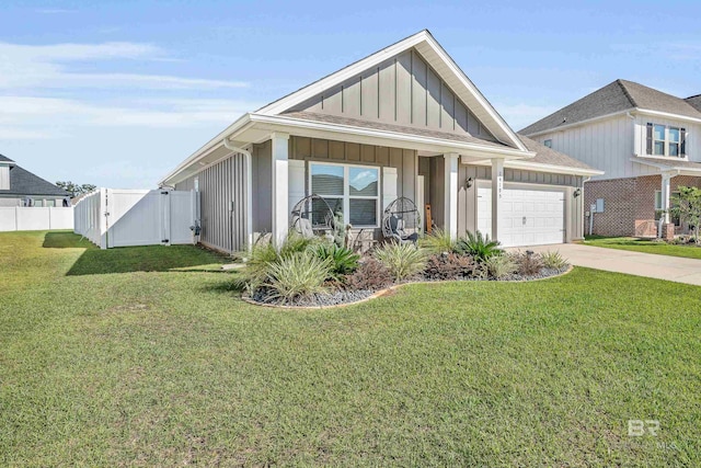 view of front of house with a front yard and a garage