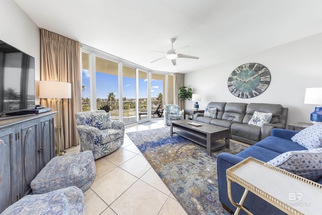 28105 Perdido Beach Blvd Unit C-314, Orange Beach, AL 36561 - living area with light tile patterned floors, a ceiling fan, and expansive windows