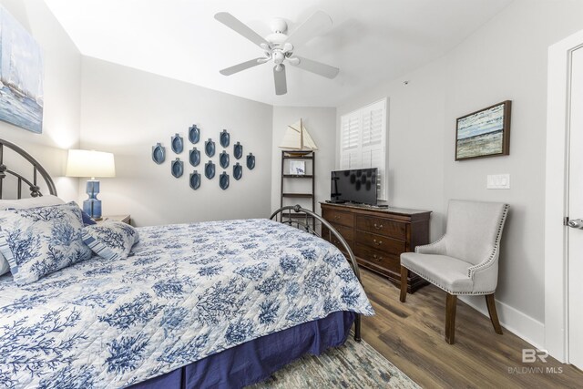 28105 Perdido Beach Blvd Unit C-314, Orange Beach, AL 36561 - bedroom with baseboards, ceiling fan, and wood finished floors