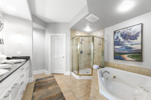 28105 Perdido Beach Blvd Unit C-314, Orange Beach, AL 36561 - full bathroom with visible vents, double vanity, tile patterned flooring, a whirlpool tub, and a shower stall