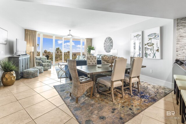 28105 Perdido Beach Blvd Unit C-314, Orange Beach, AL 36561 - dining space featuring a ceiling fan, light tile patterned floors, and a wall of windows