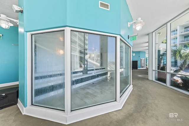 28105 Perdido Beach Blvd Unit C-314, Orange Beach, AL 36561 - exterior space with carpet flooring, visible vents, and floor to ceiling windows