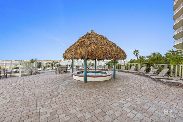28105 Perdido Beach Blvd Unit C-314, Orange Beach, AL 36561 - surrounding community featuring fence, a jacuzzi, and a patio area