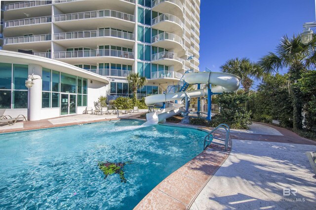 28105 Perdido Beach Blvd Unit C-314, Orange Beach, AL 36561 - community pool featuring a water slide and a patio area