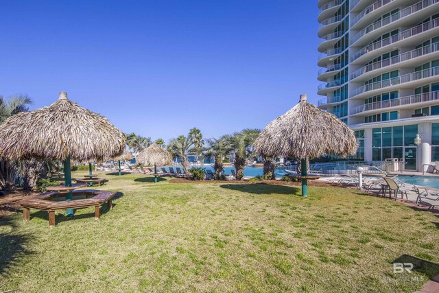28105 Perdido Beach Blvd Unit C-314, Orange Beach, AL 36561 - surrounding community featuring a lawn and a pool