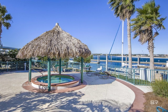 28105 Perdido Beach Blvd Unit C-314, Orange Beach, AL 36561 - view of property's community with a water view, a jacuzzi, and fence