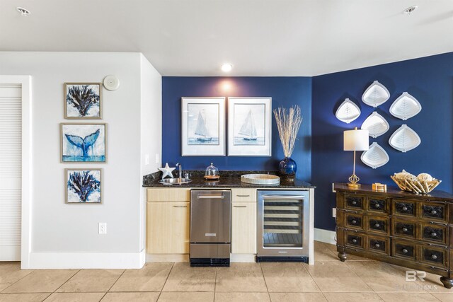 28105 Perdido Beach Blvd Unit C-314, Orange Beach, AL 36561 - bar with a sink, indoor wet bar, baseboards, light tile patterned floors, and wine cooler