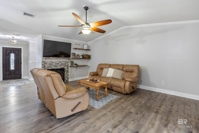 living room featuring ornamental molding, lofted ceiling, hardwood / wood-style floors, and ceiling fan