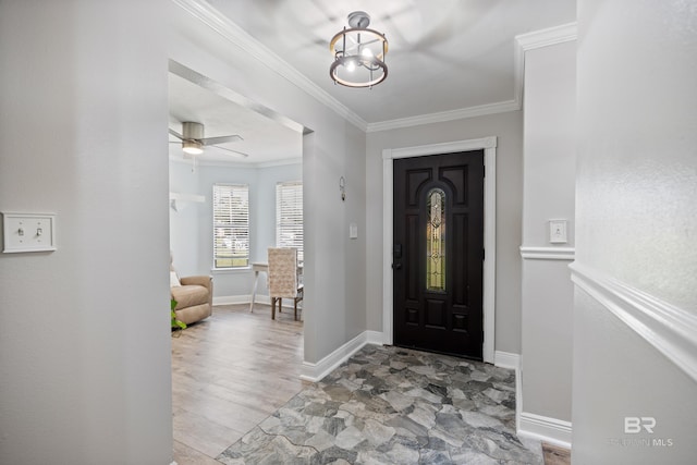 foyer entrance featuring ceiling fan, ornamental molding, and light hardwood / wood-style flooring