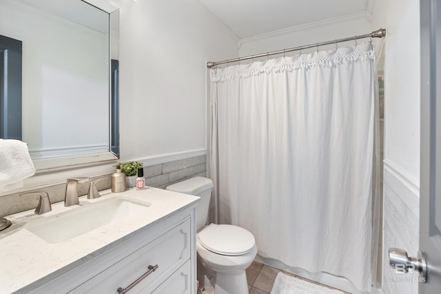 bathroom with crown molding, a shower with curtain, vanity, tile patterned flooring, and toilet