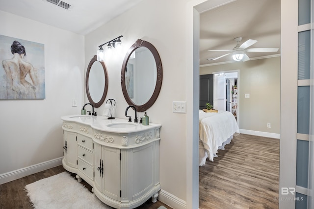 bathroom featuring hardwood / wood-style floors, ceiling fan, and vanity