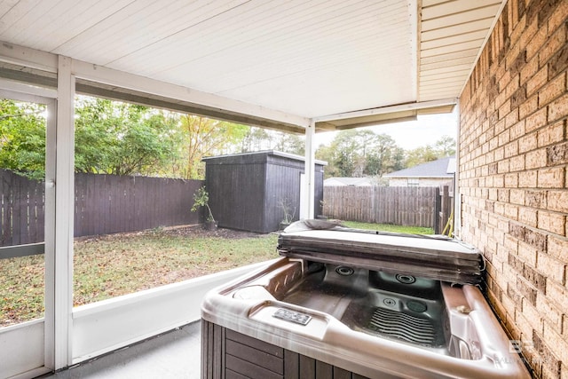 sunroom / solarium featuring a hot tub