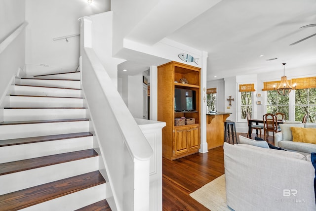 25773 Canal Rd Unit 28, Orange Beach, AL 36561 - stairs with recessed lighting, visible vents, wood finished floors, and ceiling fan with notable chandelier